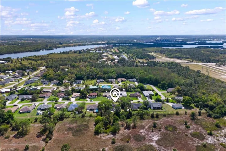 Drone / aerial view featuring a water view and a residential view