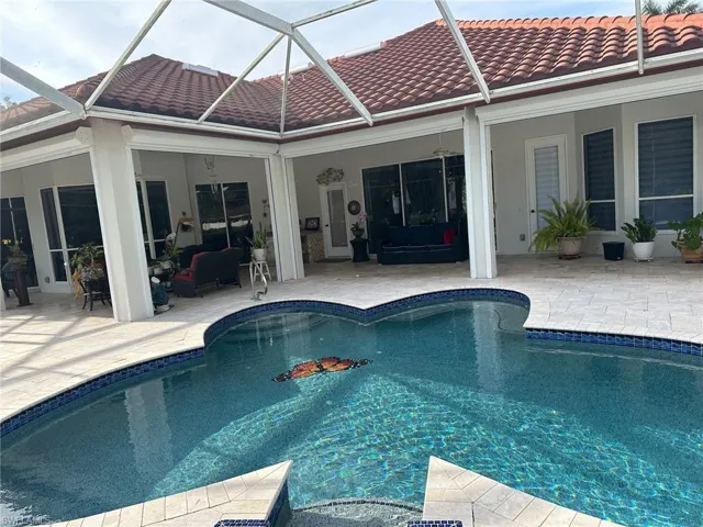 Outdoor pool featuring outdoor lounge area and a patio
