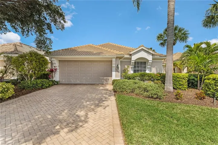 Welcome to your new home featuring decorative paver driveway, stucco siding, an attached garage, and a newer tiled roof.