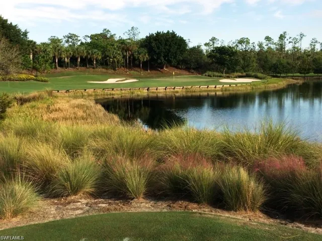 View of golf hole with water feature.