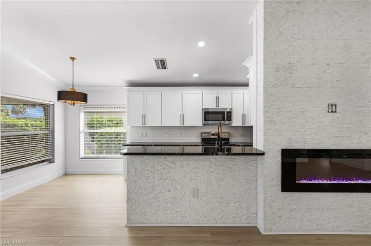 Nice open floor plan with a breakfast bar.
