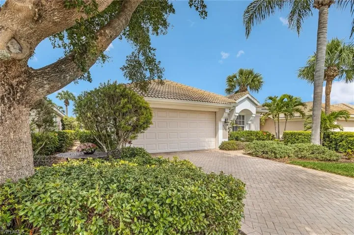 Front entry has some nice mature trees and landscaping.