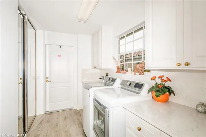 LAUNDRY ROOM WITH WINDOW AND STORAGE
