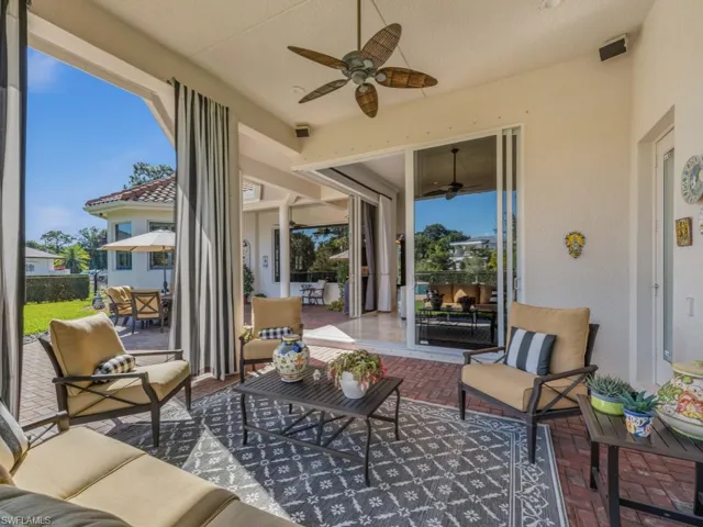 Sunroom featuring an outdoor hangout area, a patio, ceiling fan, and outdoor dining area