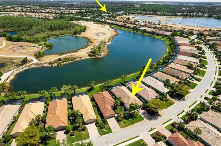 Aerial overview of property's location featuring nearby suburban area and a nearby body of water