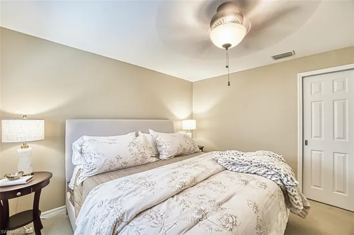 Bedroom with carpet and a ceiling fan