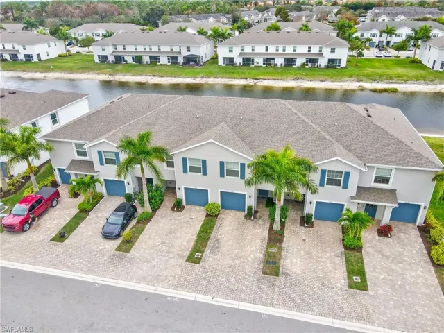 Aerial perspective of suburban area with a large body of water