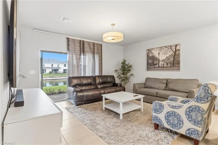 Living room featuring light tile patterned floors