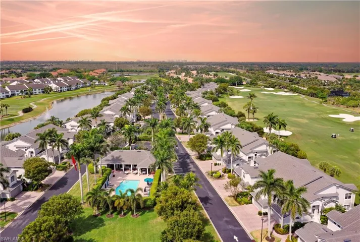 Aerial view with a residential view, golf course view, and a water view
