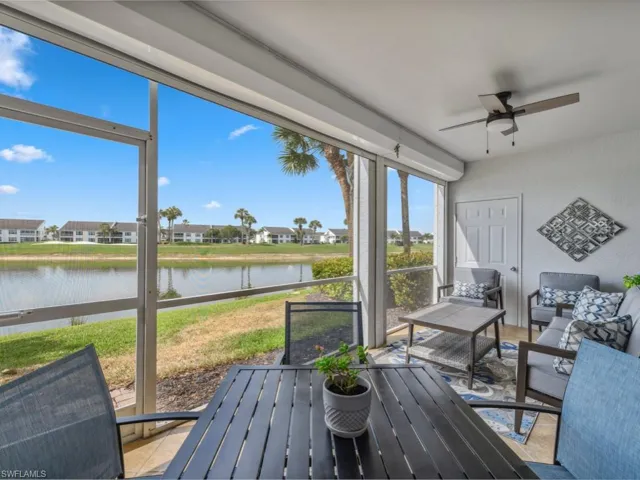 Sunroom / solarium featuring an outdoor hangout area, a water view, and ceiling fan