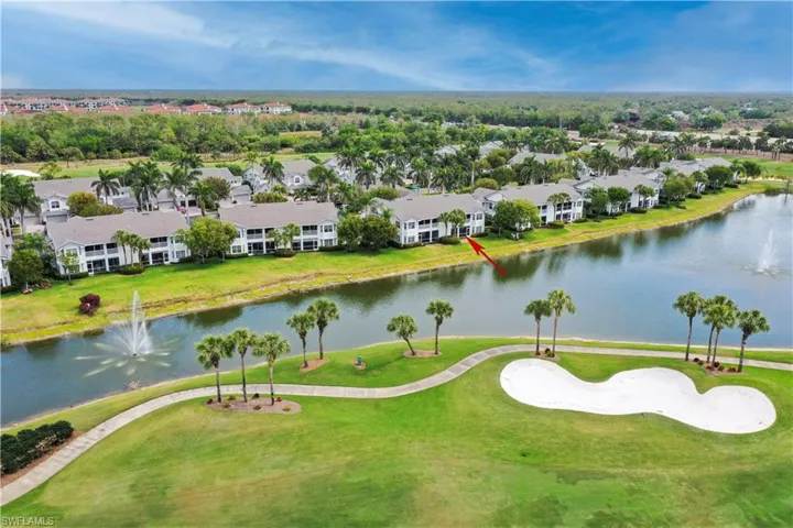 Drone / aerial view with a residential view and a water view
