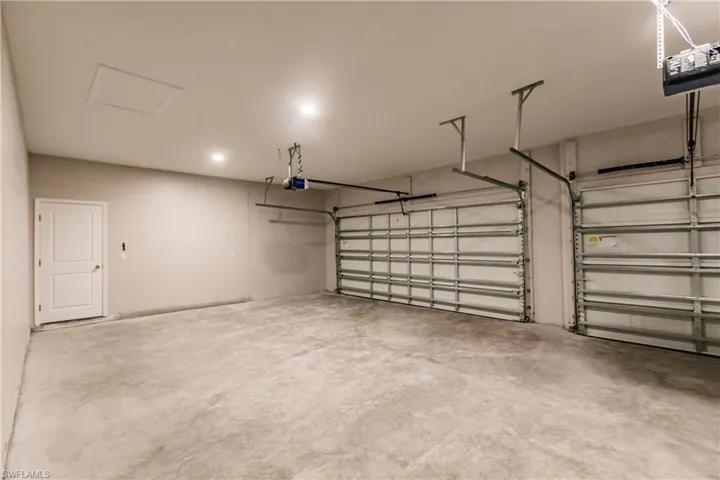 Garage featuring a garage door opener