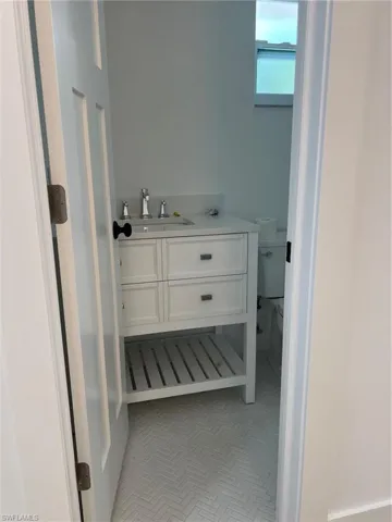 Bathroom featuring vanity and toilet