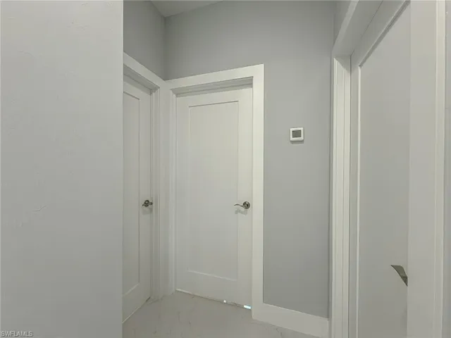 Hallway with marble finish floor