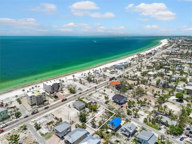 Bird's eye view with a view of the beach and a water view