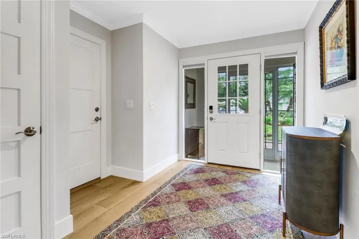 Solid wood doors and quality wood-look tile flooring throughout home