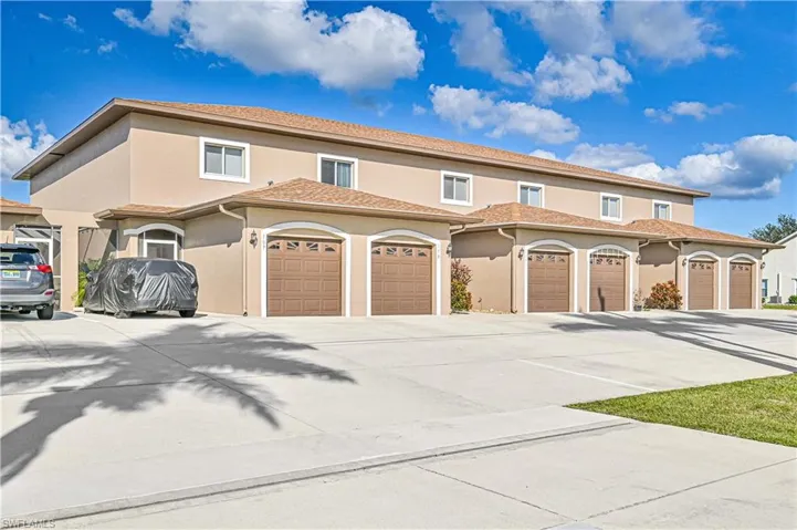 Mediterranean / spanish-style house with a garage