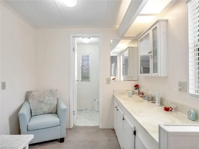 Bathroom featuring tile floors, toilet, and vanity