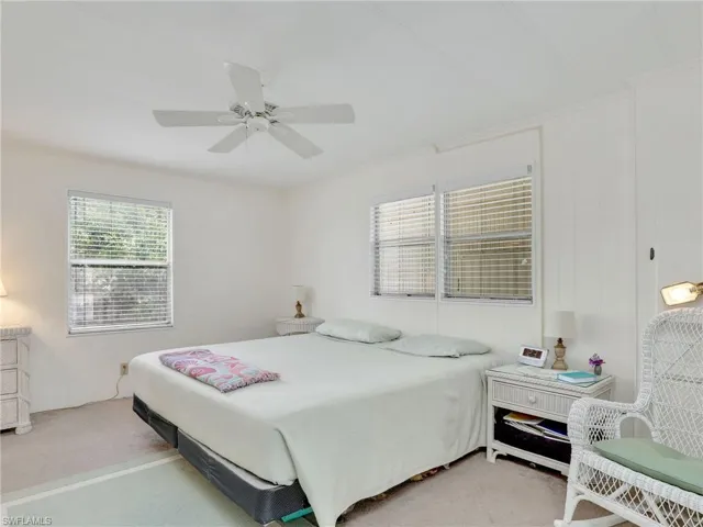 Bedroom featuring ceiling fan and carpet floors