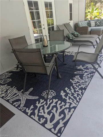 View of patio / lanai with french doors and outdoor dining space