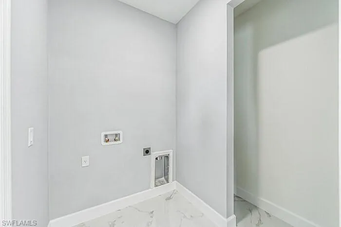 Laundry area with electric dryer hookup, washer hookup, and tile floors