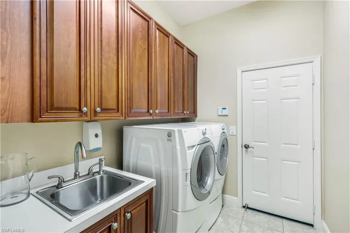 LAUNDRY RM IN THE MAIN RESIDENCE-WALK THROUGH TO THE ATTACHED 2 CAR GARAGE