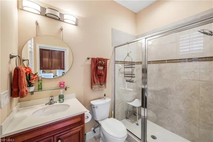 FULL BATHRM IN GST QTRS-LGE WALK IN SHOWER W/DECO TILE