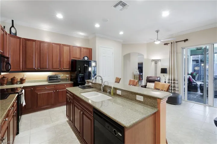 DESIGN HIGHLIGHTS-ARCHED DOORWAYS, CROWN MOLDINGS, LGE TILES, DOUBLE SINK