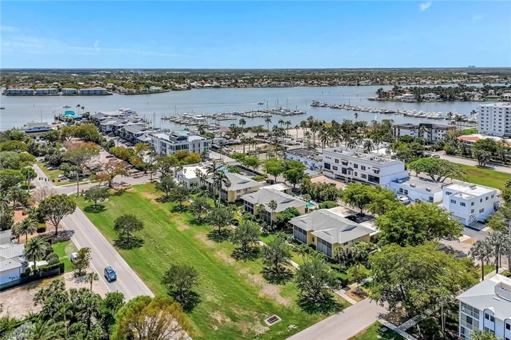 Aerial view of a nearby body of water and a marina