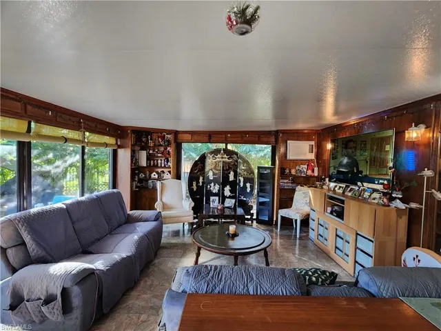 View of living room with built in bookcases
