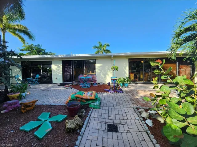 View of rear yard and patio