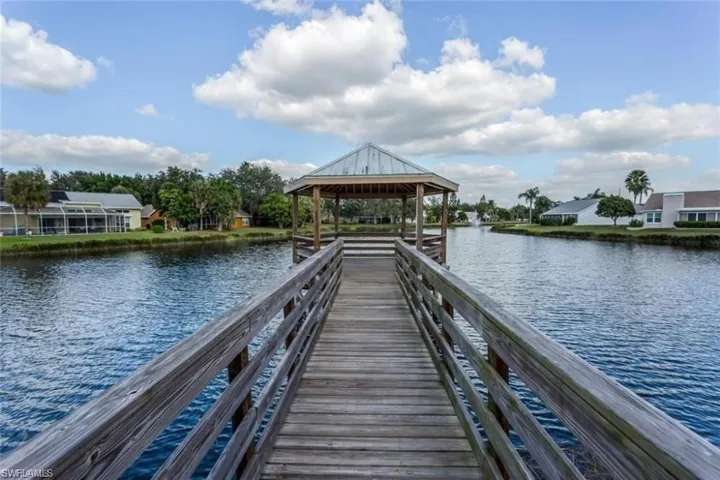 View of fishing dock with a water view and a gazebo