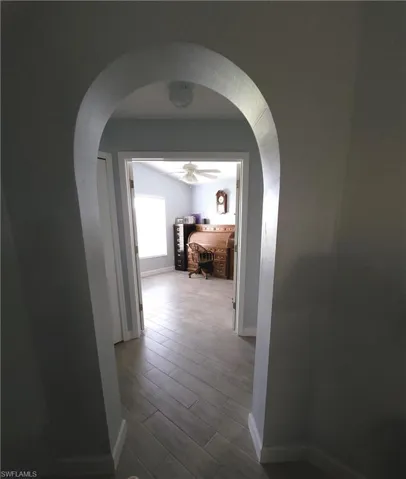 Corridor and Office with wood-style tile flooring