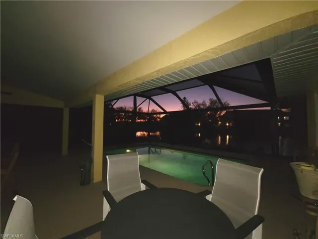 View of pool at sunset