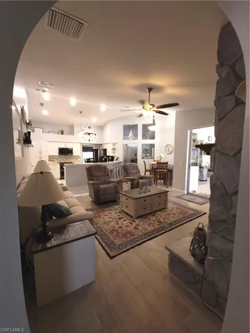 Family room, tile floors, stone fireplace access to lanai