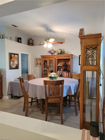 Dining space featuring ceiling fan and light floors