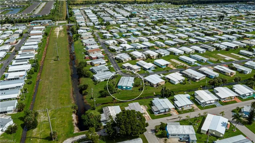 View of property location with nearby suburban area