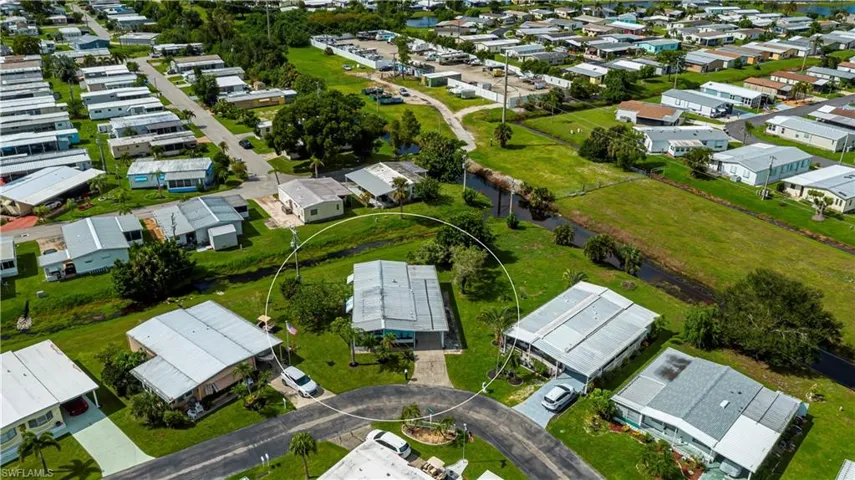 View of property location with nearby suburban area and a nearby body of water