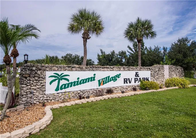 Community sign featuring a lawn