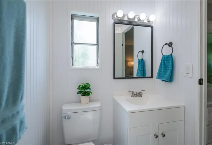 Half bath with vanity and toilet
