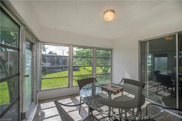 Sunroom featuring outdoor dining space