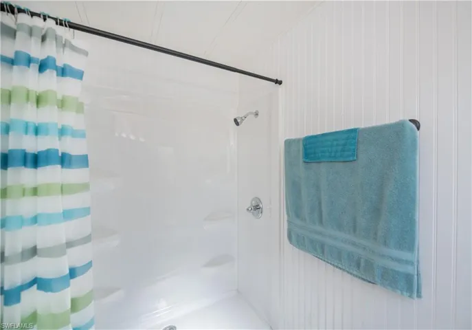 Bathroom with a shower with curtain