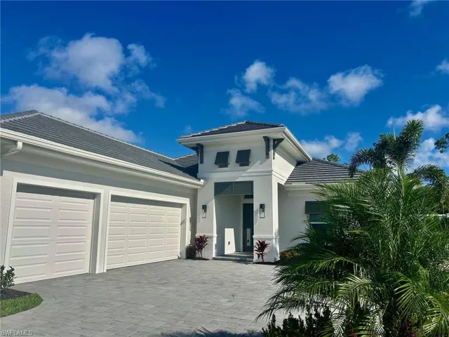 View of front of home featuring a garage