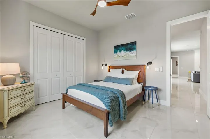 Bedroom with a closet and ceiling fan