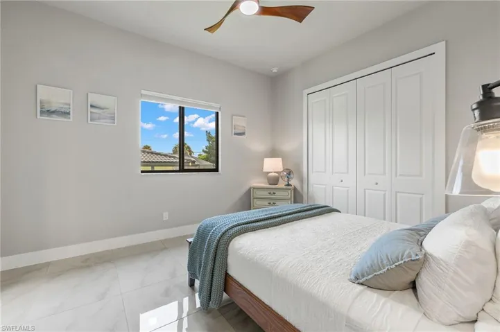 Bedroom featuring a closet and ceiling fan