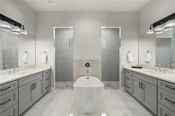 Bathroom with vanity and independent shower and bath