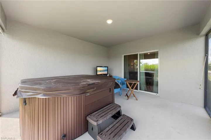 View of patio / terrace featuring a hot tub