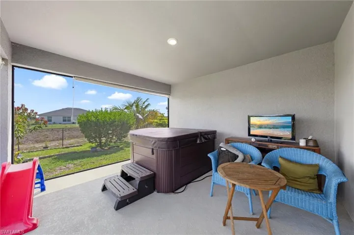View of patio featuring a hot tub