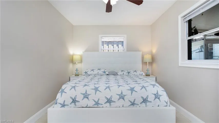 Bedroom with baseboards and ceiling fan