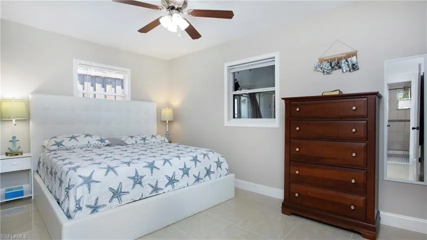 Bedroom with baseboards and a ceiling fan